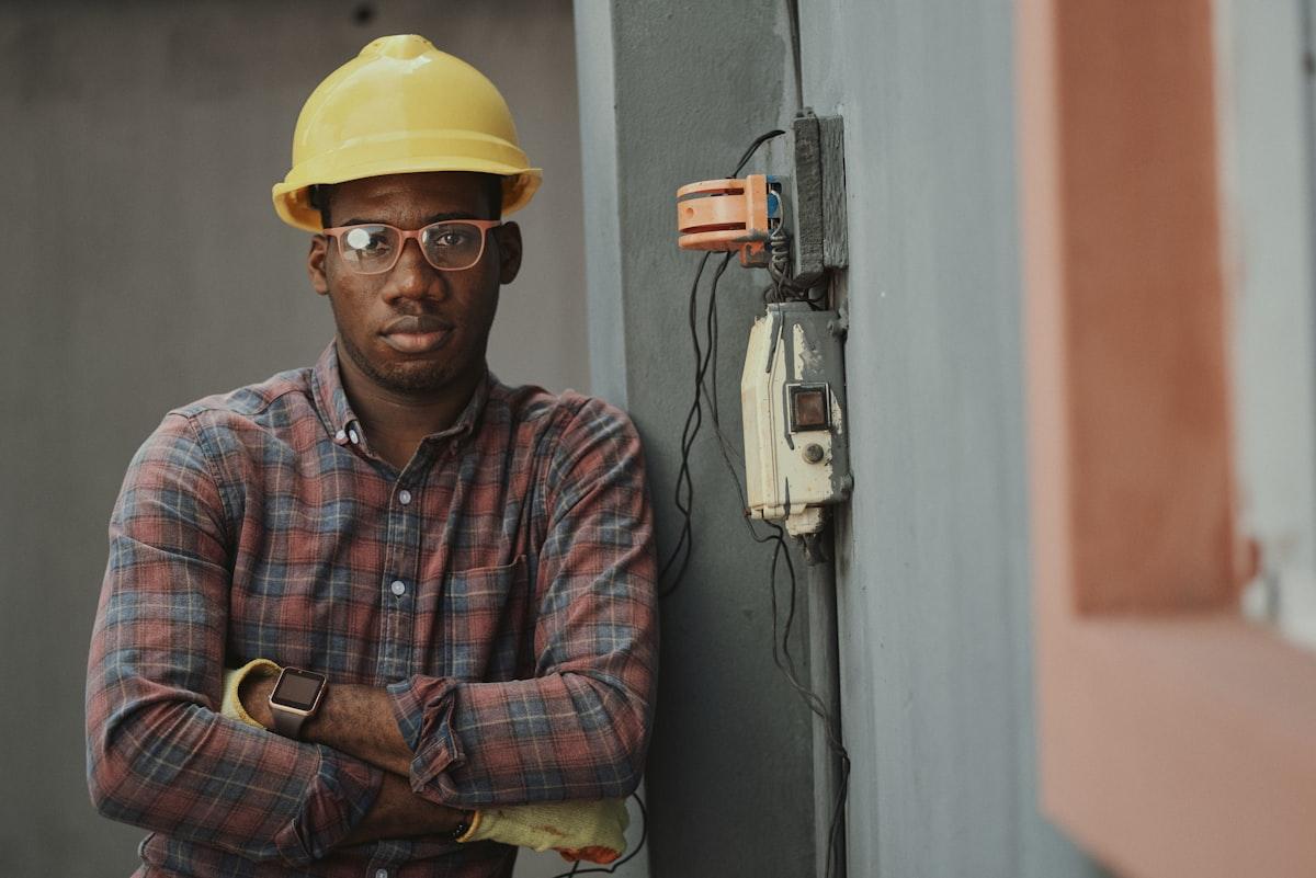 Tenant inspecting a maintenance issue in a rental property kitchen